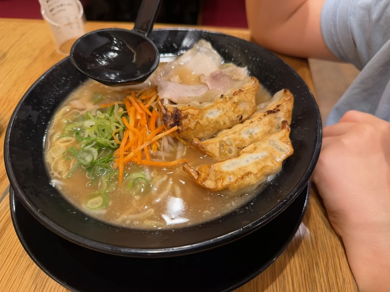 Bowl of ramen topped with crispy gyoza, Osaka