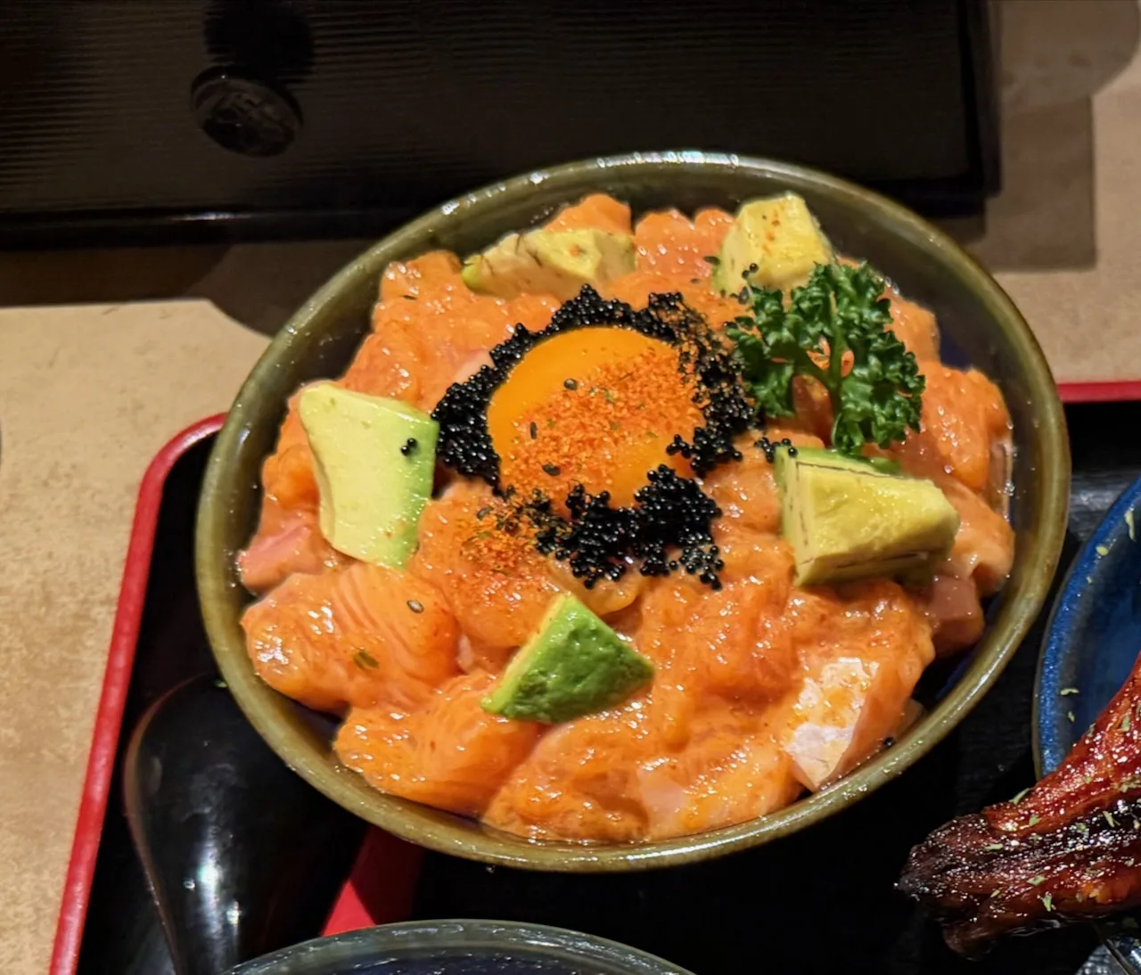 Salmon rice bowl with avocado, fish roe and egg yolk, Osaka