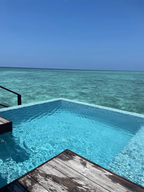overwater villa infinity pool, turquoise lagoon, Maldives, our trip 2024
